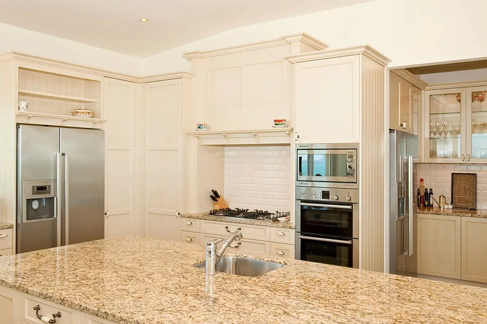 Traditional Auckland kitchen renovation with cream joinery and a granite benchtop
